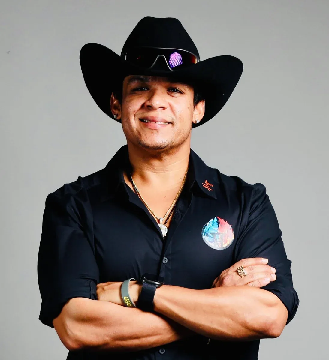 Portrait of Hugo in a black cowboy hat and company shirt