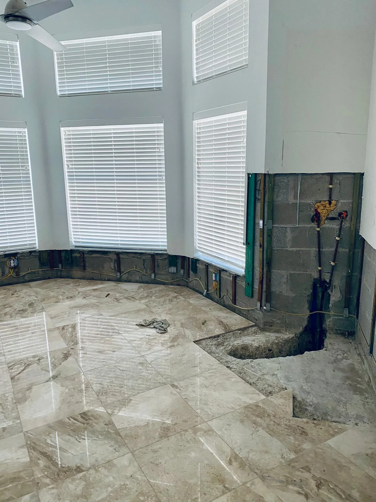 Lower wall sections removed beneath tall windows
