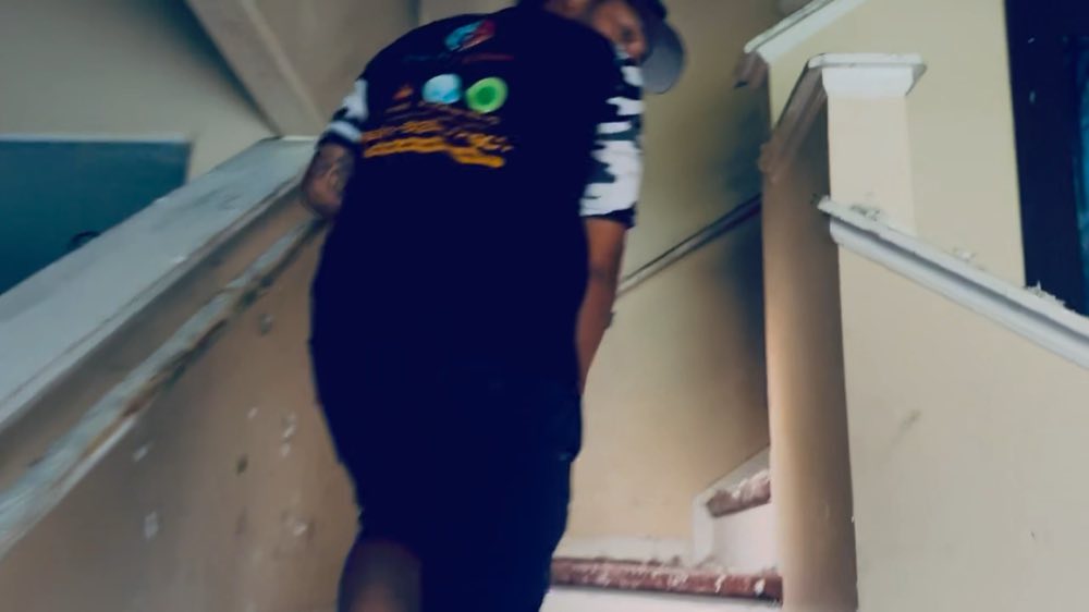 Team member climbing a stairway during restoration