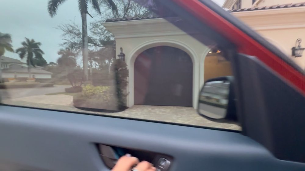 House entrance viewed through a vehicle window