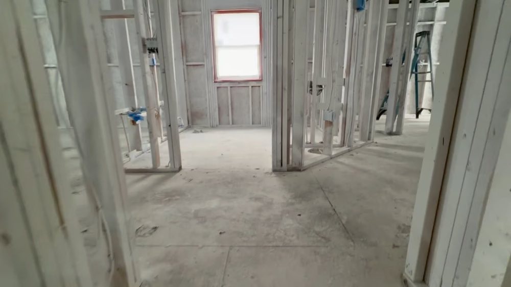 View through multiple rooms with exposed wall studs