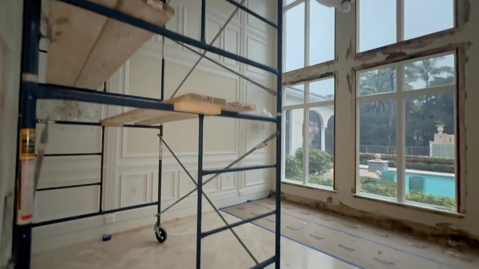 Scaffolding beside tall windows during restoration